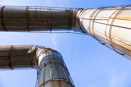 Elevated section of the pipelines against the blue skyの写真素材