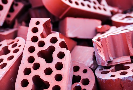 Pile of new but beaten silicate bricks. Closeup.の写真素材
