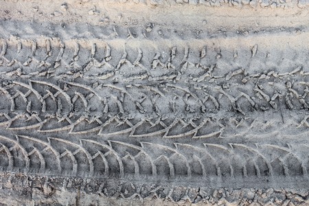 Close up of the wheel tracks on the ground.の写真素材