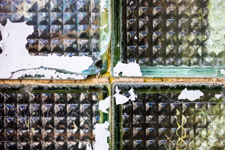 The old and damaged glass bricks surface.の写真素材