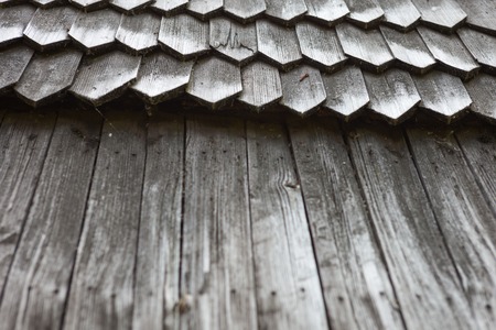 Old wooden shingle roof. Wooden surface texture.