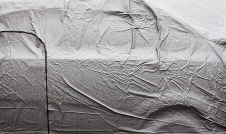 Wet surface of the gray car cover. Close up.の写真素材