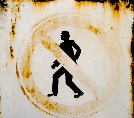 Old metal No Pedestrians sign. Close up.の写真素材