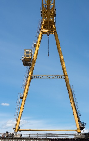 Gantry crane against the blue sky background