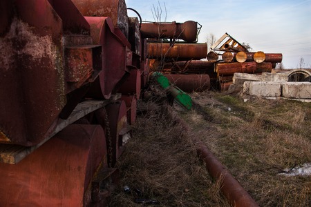 Stack of the old abandoned rusty metal pipes.の写真素材