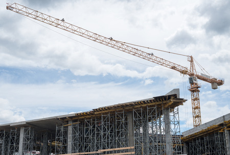 Construction site. Framework of the new building and tower crane above it.