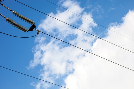 Suspended insulators of the high-voltage electric power transmission.