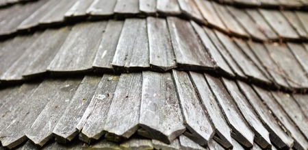 The old wooden shingle roof. Close up.の写真素材