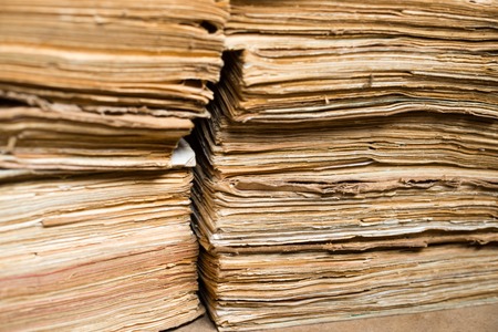 Stack of the old paper documents in the archive.