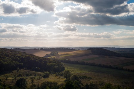 Landscape in a cloudy day. Ukrainian Bukovina region. Carpathian Mountains in the distance.の写真素材