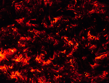 Embers of a fire glowing with heat. の写真素材