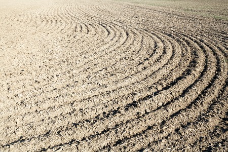 Ploughed field in spring prepared for sowing.の写真素材