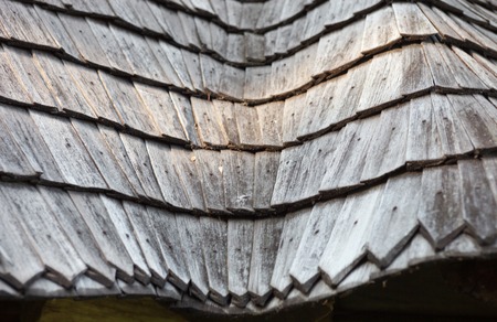 The old wooden shingle roof. Close up.の写真素材