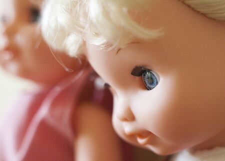 The faces of the blonde dolls. Close up.の写真素材
