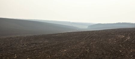 Ploughed field in early spring in Ukraine.の写真素材