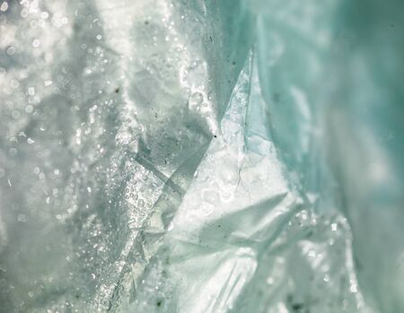 Surface of the polythene covered with drops of water.
