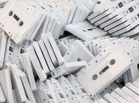 White cassette tapes (compact cassettes or musicassettes, MC). Analog magnetic tape recording format...