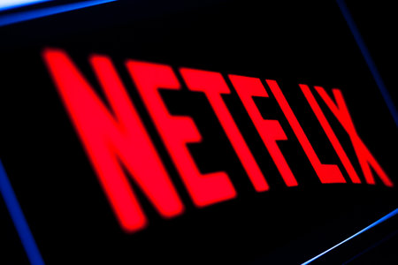 Kyiv, Ukraine -  March 9, 2021: Netflix logo on the screen. Netflix is an American content platform and production company offering online streaming service from a library of films and TV series.のeditorial素材