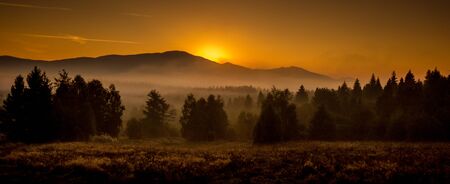Sunrise in the woodlands of the Polish mountains.の写真素材