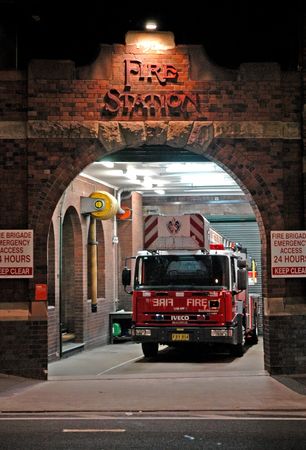 fire-station at night, red fire truck waitingの写真素材