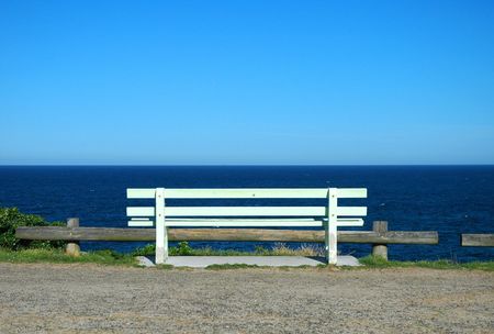 white wooden bench, ocean view, solitudeの写真素材