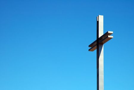 detail photo of a steel cross, blue sky,の写真素材