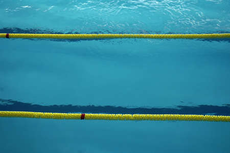 empty swimming pool detail, three swimming lanes divided with plastic barrier, photo taken in Humenné - Slovakiaの写真素材
