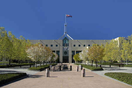Parliament House in Australian capital city Canberra, waving flagの写真素材
