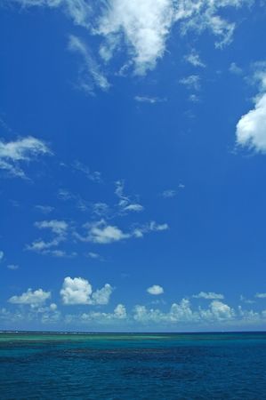 ocean scene, blue sky with white clouds, great barrier reefの写真素材