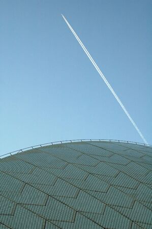 jet flying over opera house in sydney, abstract photo