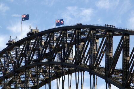bridge walking on harbour bridge in sydney, australian flagsの写真素材