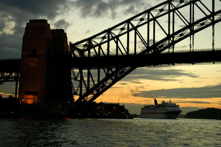 Harbour Bridge evening silhouette, big ship in backgroundの写真素材