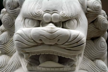 white buddhist sculpture, probably a dog or soの写真素材