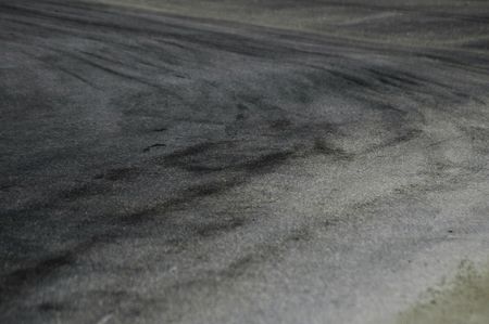 dirty asphalt rally road; tyres skids; gravelの写真素材