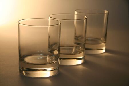three empty cocgnag glasses, distance blurの写真素材