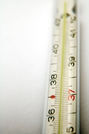 detail photo of medical thermometer on white background, distance blur