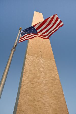 obelisk and waving american flag, photo taken in washington, but can be used as almost any american obelisk :-)の写真素材