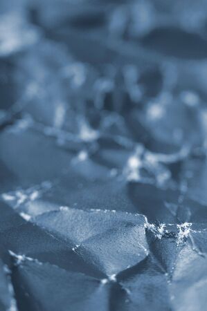 blue wrinkled paper background, vertical photo