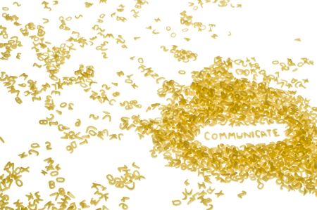 word COMMUNICATE created form pasta letters on white backgroundの写真素材