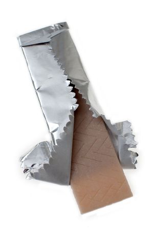 chewing gum partly opened, isolated on white backgroundの写真素材