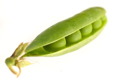 green fresh pea isolated on white backgroundの写真素材