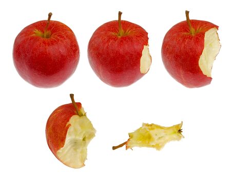 red apple in different stages of eating, isolated on white backgroundの写真素材