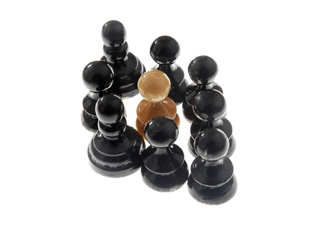 chess pieces arranged as a racism scene