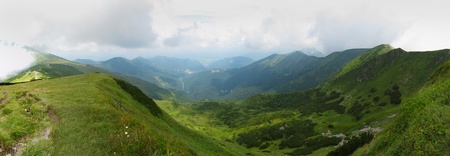 panorama photo of a mountain range during summerの写真素材