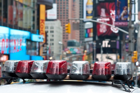 31. MARCH 2011 - TIMES SQUARE, NEW YORK CITY, USA - Police Car Lights detail, Times Square billboards defocused in background. Photo taken on 31 march 2011 in New York.のeditorial素材