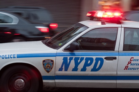 31. MARCH 2011 - MANHATTAN, NEW YORK, USA - NYPD police car detail in motion. Photo taken in New York City, on 31 march 2011.のeditorial素材