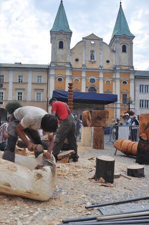 5. AUGUST 2011 - ZILINA, SLOVAKIA - carpenter artists on Marianske Namestie (Town Square) in Zilina, Slovakia. Photo taken on 5 august 2011.のeditorial素材