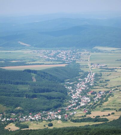 villages Zemplinske Hamre (foreground) and Bila nad Cirochou near town Snina, Slovakia.の写真素材
