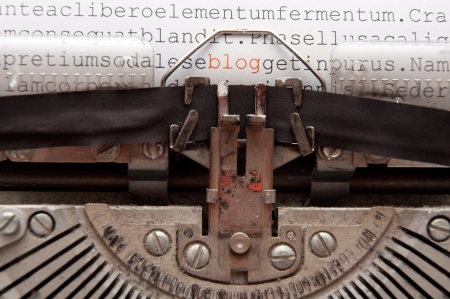 word 'blog' and other text written on an old typewriterの写真素材