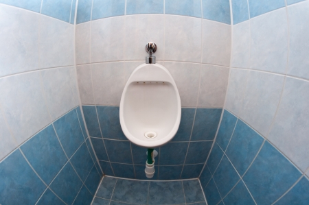 white clean urinal object, wide angel photo, tiled walls and floorの写真素材
